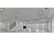 A finished basement with recessed lighting, multiple windows, stairs, and light wood-look flooring at 4155 Winterberry Rd, Cumming, GA 30040