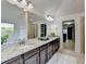 Elegant primary bathroom with dual sinks, granite countertops, tub, and shower, offering a spa-like experience at 4155 Winterberry Rd, Cumming, GA 30040