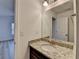 A light and bright bathroom with granite countertops and neutral paint at 4155 Winterberry Rd, Cumming, GA 30040