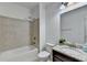 Clean bathroom featuring a shower-tub combo and a granite vanity with a mirror at 4155 Winterberry Rd, Cumming, GA 30040