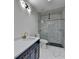 Elegant bathroom features marble tiling, modern fixtures, and a glass-enclosed shower at 4155 Winterberry Rd, Cumming, GA 30040