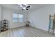 Simple bedroom with a ceiling fan, a window, and a ladder with a blanket at 4155 Winterberry Rd, Cumming, GA 30040