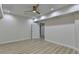 Bright bedroom featuring neutral walls, light flooring, a ceiling fan, and white trim at 4155 Winterberry Rd, Cumming, GA 30040