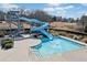 Community pool featuring a water slide, creating an exciting and recreational space for residents at 4155 Winterberry Rd, Cumming, GA 30040