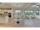 Elegant dining room features modern chandelier and opens to a modern kitchen at 4155 Winterberry Rd, Cumming, GA 30040