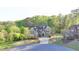 Brick home with well-manicured lawn and landscaping on a verdant lot at 4155 Winterberry Rd, Cumming, GA 30040