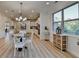 The open concept kitchen flows into the dining room creating an entertainers space at 4155 Winterberry Rd, Cumming, GA 30040