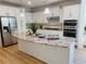 Modern kitchen featuring white cabinetry, stainless steel appliances, and granite countertops at 4155 Winterberry Rd, Cumming, GA 30040