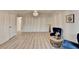 Open living room with hardwood floors, modern furnishings, and plenty of natural light at 4155 Winterberry Rd, Cumming, GA 30040