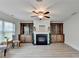 Cozy living room showcases built-in shelving, a fireplace, and neutral tones, perfect for relaxing or entertaining at 4155 Winterberry Rd, Cumming, GA 30040