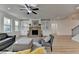 Sunlit living room with fireplace and built-in cabinets, perfect for entertaining at 4155 Winterberry Rd, Cumming, GA 30040