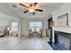 Living room with fireplace and built-ins, plus lots of seating space for entertaining guests at 4155 Winterberry Rd, Cumming, GA 30040