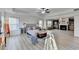 Spacious main bedroom featuring a tray ceiling, sitting area with fireplace, and neutral decor at 4155 Winterberry Rd, Cumming, GA 30040