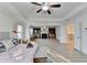 Open concept main bedroom with a fireplace and sitting area, plus a view of the stairway at 4155 Winterberry Rd, Cumming, GA 30040