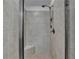 Walk-in shower features neutral tile, a built-in seat, and a modern shower head at 4155 Winterberry Rd, Cumming, GA 30040