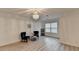 Cozy sitting room with hardwood floors, stylish chandelier, and plenty of natural light at 4155 Winterberry Rd, Cumming, GA 30040