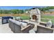 Relaxing backyard with an outdoor fireplace, a grill, and plenty of seating on the patio at 105 Aspen Hall Dr, Canton, GA 30115