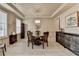Formal dining room with a decorative chandelier, tray ceilings and ample space for entertaining at 105 Aspen Hall Dr, Canton, GA 30115