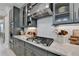Close up on the stainless gas range and custom cabinets, offering a modern cooking experience at 105 Aspen Hall Dr, Canton, GA 30115