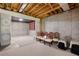 Spacious unfinished basement with concrete walls, carpet and an extra storage space near a closed door at 18 Rose Gate Ne Dr, Atlanta, GA 30342