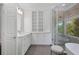 Elegant bathroom featuring walk-in shower, soaking tub, and built in storage at 18 Rose Gate Ne Dr, Atlanta, GA 30342