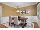 Elegant dining room featuring a wooden table with upholstered chairs, wallpaper, and a chandelier at 18 Rose Gate Ne Dr, Atlanta, GA 30342