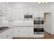 Well-equipped kitchen featuring stainless steel appliances, ample cabinetry, and stylish backsplash at 18 Rose Gate Ne Dr, Atlanta, GA 30342