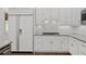 Well-organized kitchen featuring a stainless steel refrigerator, gas range, and sleek backsplash at 18 Rose Gate Ne Dr, Atlanta, GA 30342