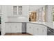 Elegant kitchen featuring stainless steel appliances, ample counter space, and view to living room at 18 Rose Gate Ne Dr, Atlanta, GA 30342