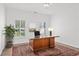 Home office featuring large desk, hardwood floors, and natural light at 18 Rose Gate Ne Dr, Atlanta, GA 30342