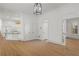 Spacious room showcasing hardwood floors, neutral walls, and a glimpse into the modern kitchen at 18 Rose Gate Ne Dr, Atlanta, GA 30342