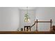 Staircase featuring wood railings and a large arched window at 18 Rose Gate Ne Dr, Atlanta, GA 30342