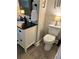 Bathroom featuring a vanity with modern fixtures and a toilet at 213 Mccready Dr, Dallas, GA 30157