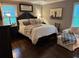 Cozy bedroom with a comfortable bed, a seating area, and natural light at 213 Mccready Dr, Dallas, GA 30157