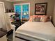 Cozy bedroom features a queen bed, white furniture, and a bright window view at 213 Mccready Dr, Dallas, GA 30157