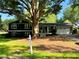 Well-maintained two-story home with a large front yard, classic architecture, and mature shade trees at 213 Mccready Dr, Dallas, GA 30157