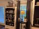 Charming living room featuring a decorative bookcase, round table, and a neutral color palette at 213 Mccready Dr, Dallas, GA 30157