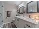 Bright bathroom featuring double sinks, quartz countertop, modern fixtures, and sleek white cabinetry at 315 Fieldridge Dr, Lawrenceville, GA 30045