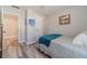 Well-lit bedroom showing natural light, hardwood flooring, a cozy bed, and neutral colors for a warm, inviting space at 315 Fieldridge Dr, Lawrenceville, GA 30045