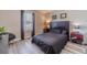 This bedroom features a large window, stylish decor, and a sleek black bed for a modern aesthetic at 315 Fieldridge Dr, Lawrenceville, GA 30045