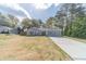 Beautiful one-story home featuring well-maintained lawn, long driveway, and welcoming facade at 315 Fieldridge Dr, Lawrenceville, GA 30045