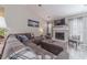 Spacious living room with a fireplace, plush sectional, and natural light from large windows at 315 Fieldridge Dr, Lawrenceville, GA 30045