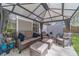 Relaxing covered patio features comfortable wicker furniture and neutral color scheme at 315 Fieldridge Dr, Lawrenceville, GA 30045