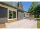 Large brick chimney and sliding glass doors lead to the patio from this charming gray brick home at 3350 Pine Meadow Nw Rd, Atlanta, GA 30327