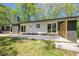 Charming home featuring a concrete patio with brick accents and natural light with access to the back yard at 3350 Pine Meadow Nw Rd, Atlanta, GA 30327