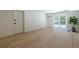 A basement featuring wood floors, access to the outdoors, and ample lighting at 3350 Pine Meadow Nw Rd, Atlanta, GA 30327
