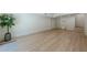 Finished basement featuring light wood floors, a large potted plant, and ample natural light at 3350 Pine Meadow Nw Rd, Atlanta, GA 30327