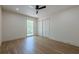 Bedroom with hardwood floors, ceiling fan, window, and large closet at 3350 Pine Meadow Nw Rd, Atlanta, GA 30327