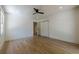Bedroom showcasing wood floors, a window and a pair of bi-fold doors to a closet at 3350 Pine Meadow Nw Rd, Atlanta, GA 30327