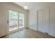 Bedroom featuring light hardwood floors, neutral walls, a sliding glass door, and natural light at 3350 Pine Meadow Nw Rd, Atlanta, GA 30327